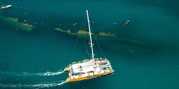 Overhead view of sailboat in ocean