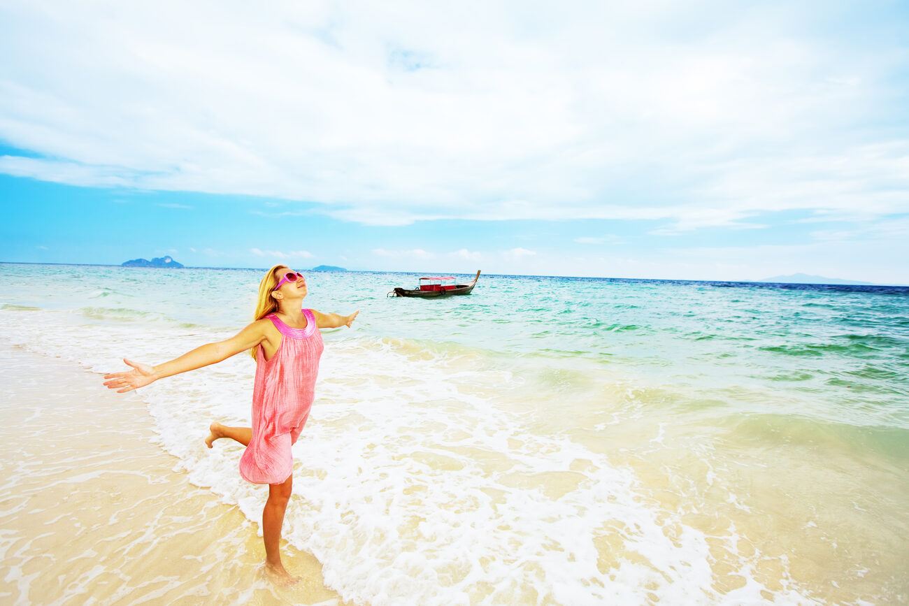 Woman dancing on the beach