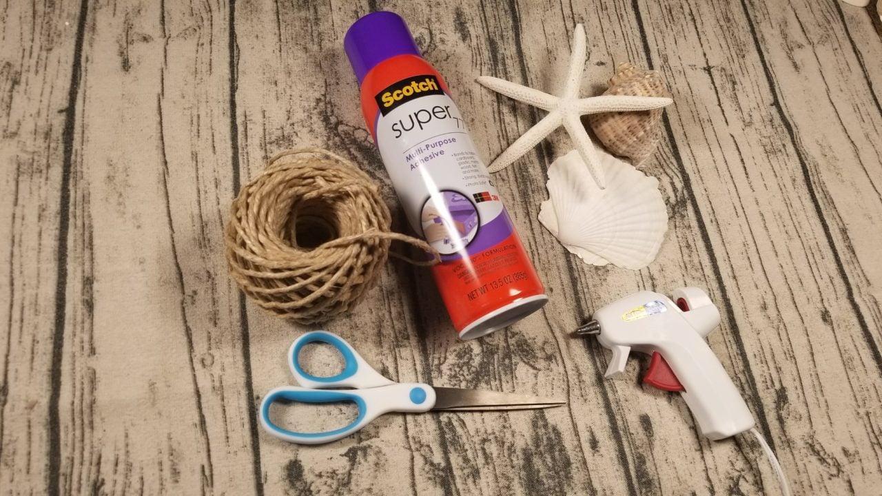 Hemp rope, scissors, spray adhesive, hot glue gun and large shells