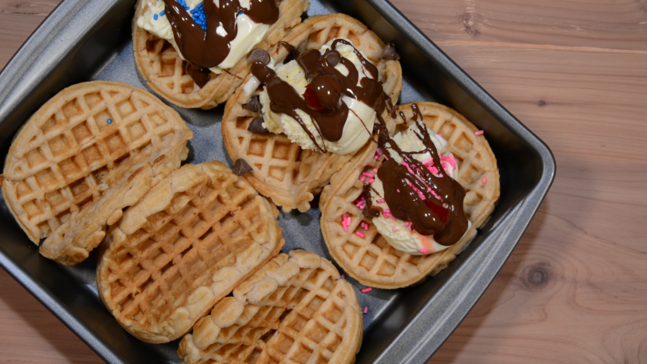 Waffles, vanilla ice cream and chocolate drizzle