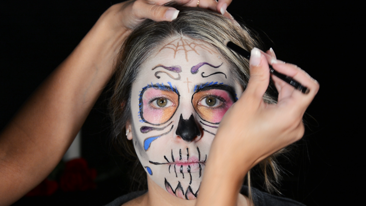 Glitter hairspray in hair, Day of the Dead face painting