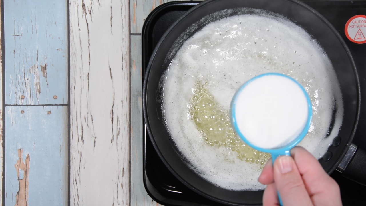 Adding sugar to butter in saucepan, Coconut Popcorn