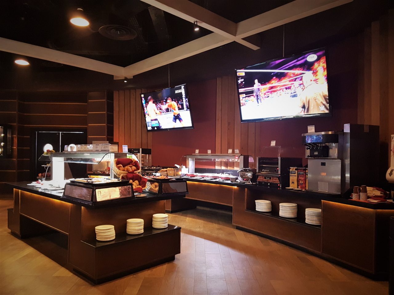 Buffet area of bar with TVs