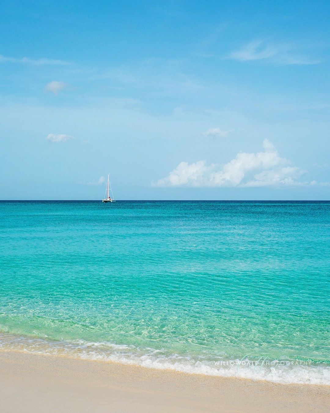 Catamaran in ocean on Seven Mile Beach