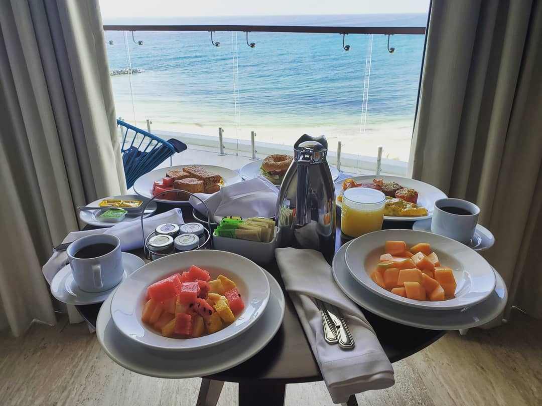 Breakfast spread on balcony.