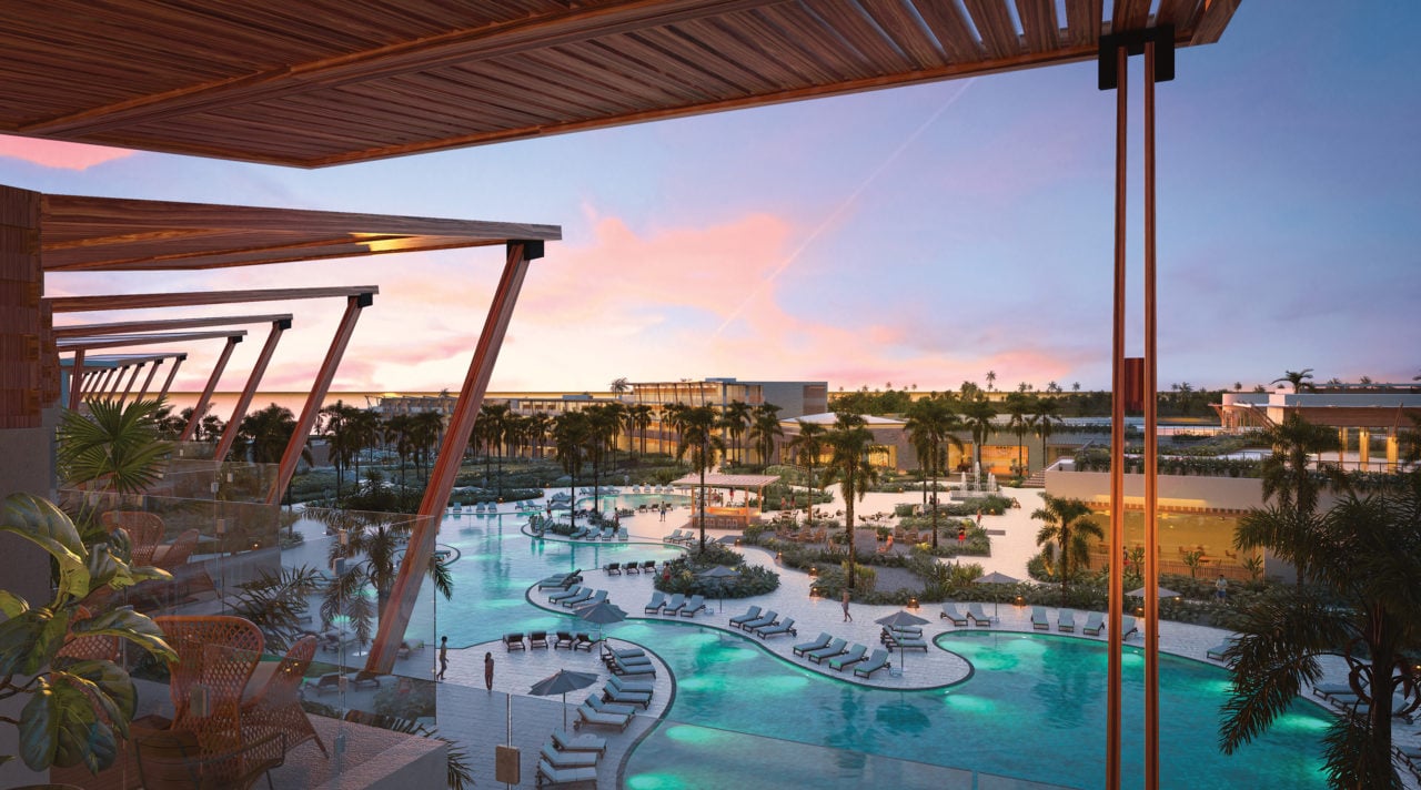 Balcony view of pool and resort grounds. 