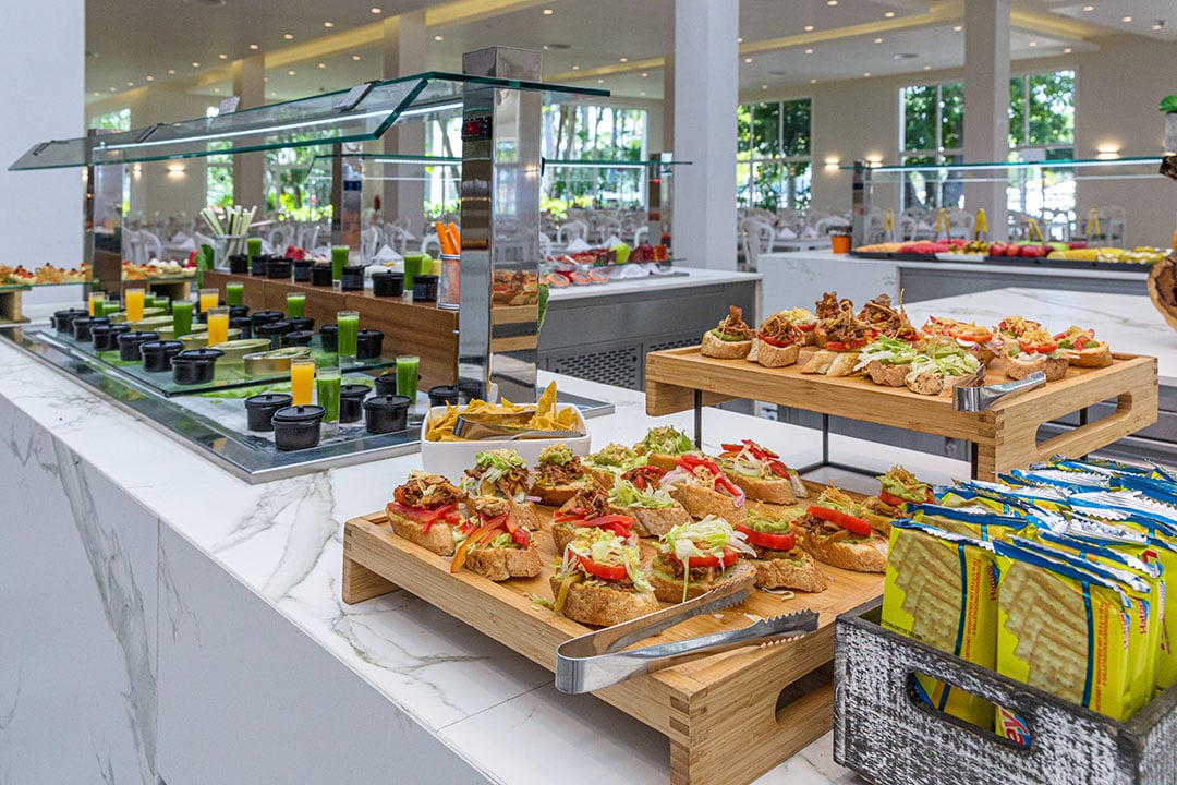 A variety of food in buffet setting.