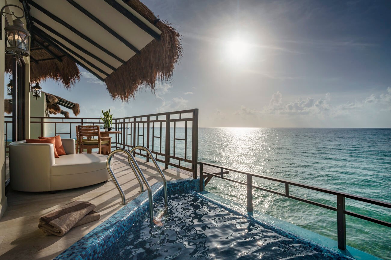 Overwater suite overlooking ocean.